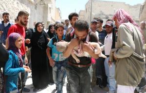 A Syrian man holds the body of his child after it was taken from under the rubble of destroyed buildings following a reported air strike on the rebel-held neighbourhood of al-Marjah in the northern city of Aleppo, on July 24, 2016. Air raids have hit four makeshift hospitals in Syria\'s battered Aleppo city, doctors said, jeopardising medical care for more than 200,000 desperate civilians in rebel-held areas. AFP Photo