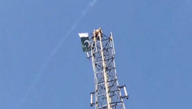 Man climbs mobile tower in Pakistan, demands PM post
