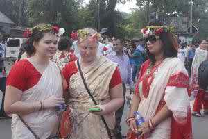 Foreigners are celebrating Pahela Baishaikh wearing sari in the capital on Thursday.     photo: bbarta24 net